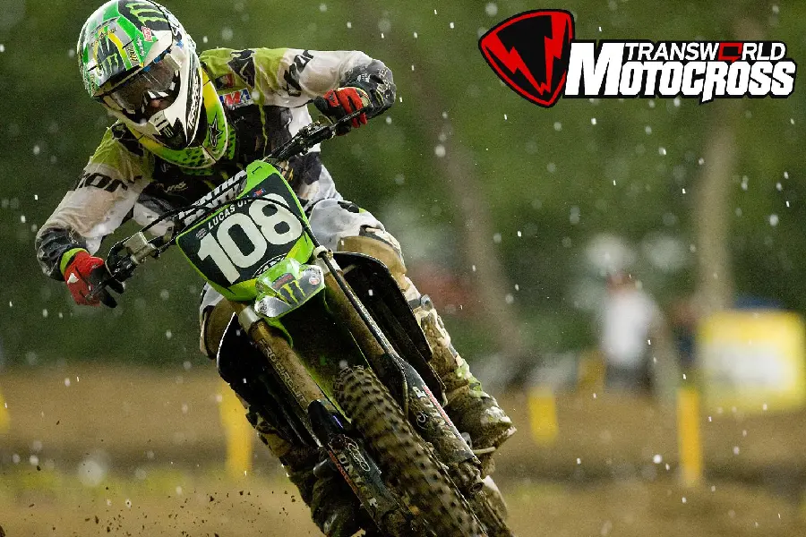 Photo of a motorcycle race with a trail on the track