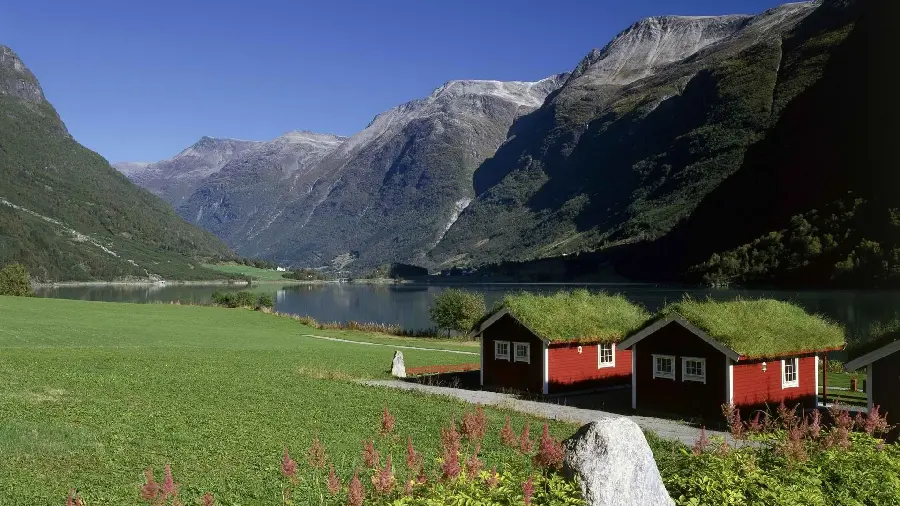 Picture of small red huts in mountain nature