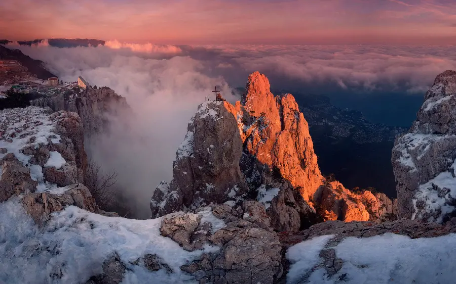 A spectacular image of fog in the sky with beautiful snow on the mountains