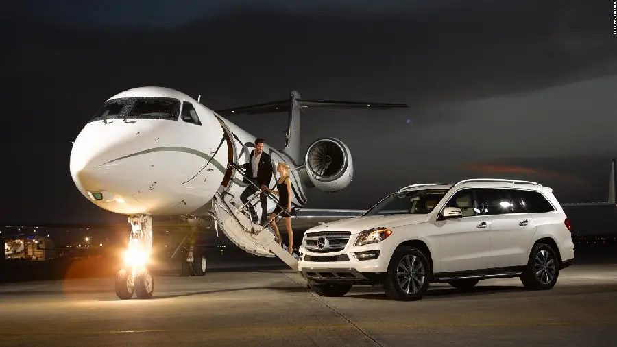 Photo of a private plane and an SUV Benz