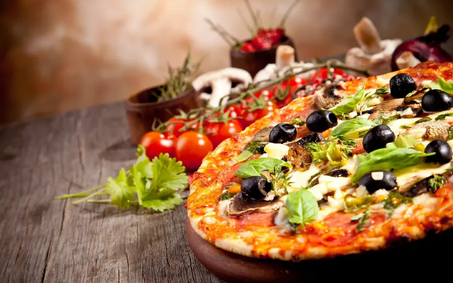 Spectacular pizza background with olives and basil decoration 2023