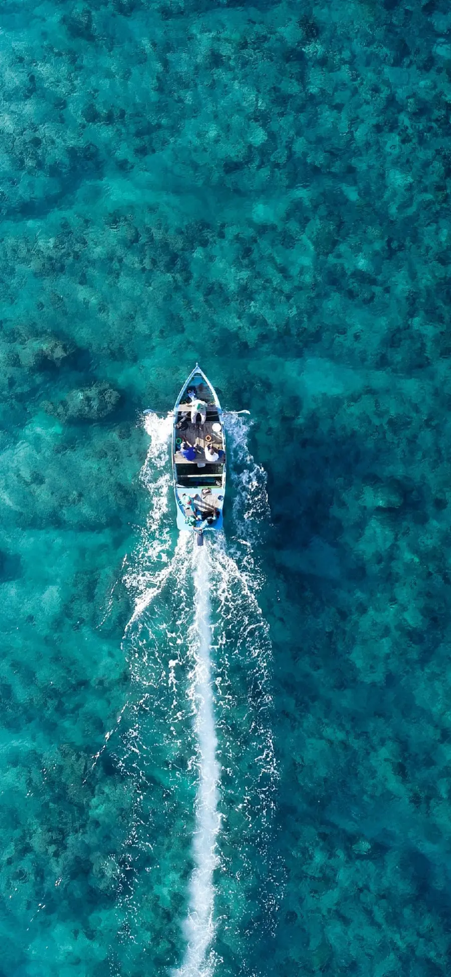 Energizing background of a beautiful and luxurious boat in the blue sea in hd quality