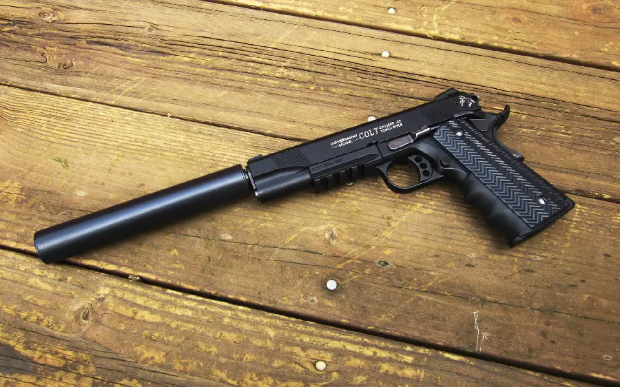 Photo and wallpaper of a Colt with a silencer for your phone and mobile