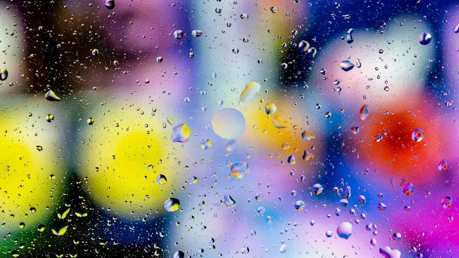 Stylish and classy wallpaper of rain glass with a beautiful colored background