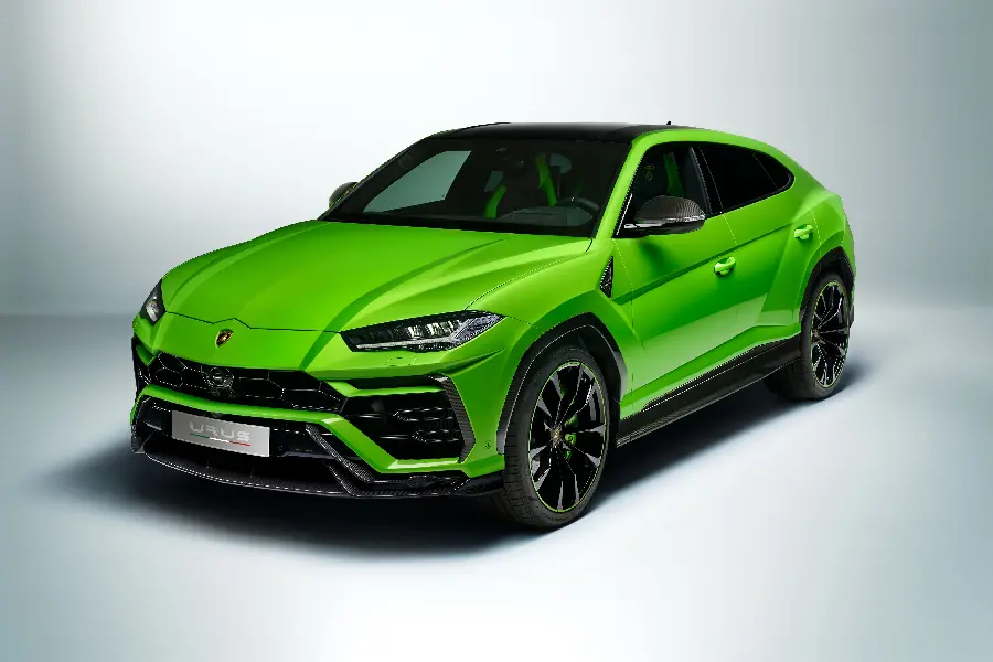 Green Lamborghini SUV with smoked windows and sporty rims