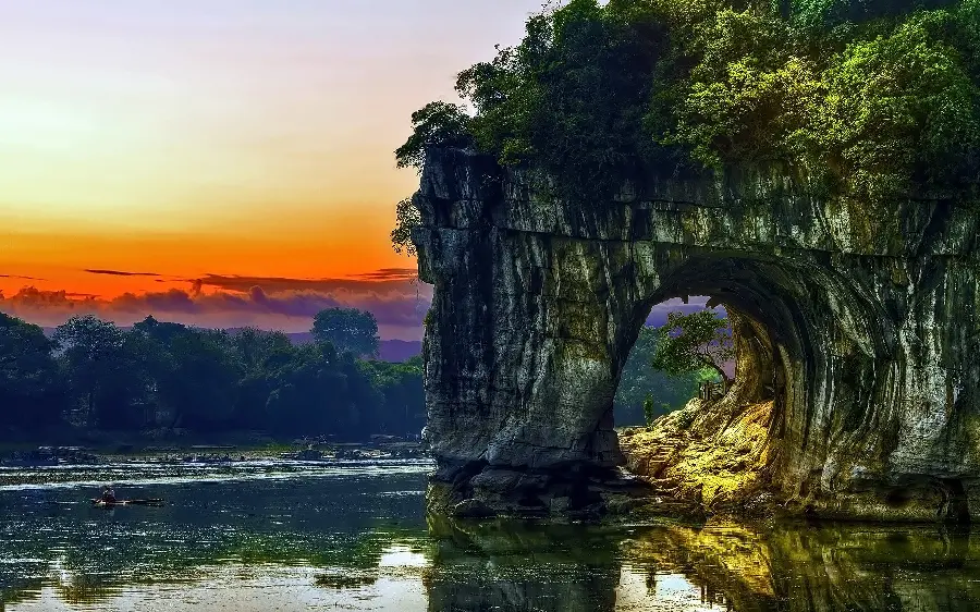 Beautiful and spectacular wallpaper of a stone tunnel with sunset 