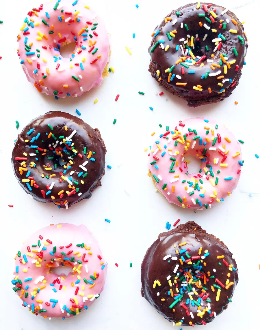 Interesting picture of fancy and colorful donuts with a white background