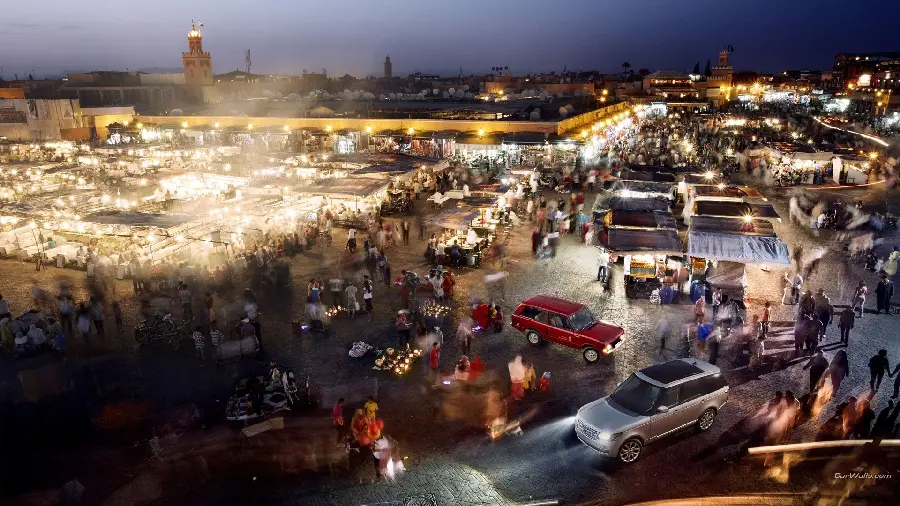 The illumination of the crowded markets of Morocco at night for the profile