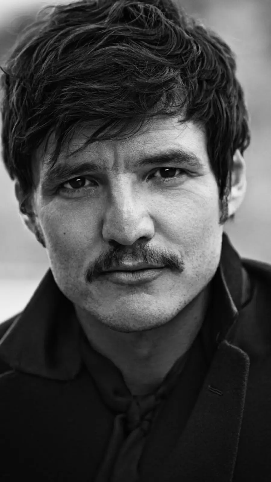 High-quality photo of Pedro Pascal with a sibyl suitable for boys' wallpaper