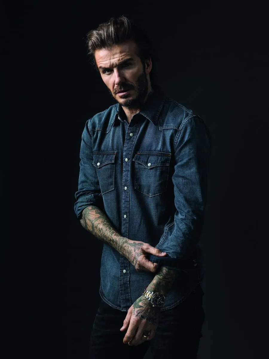 A dreamy wallpaper of handsome David Beckham with a black background