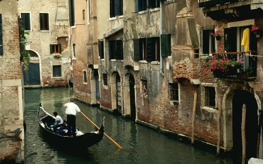 A photo of a gondola boat in the canals of Venice in high quality