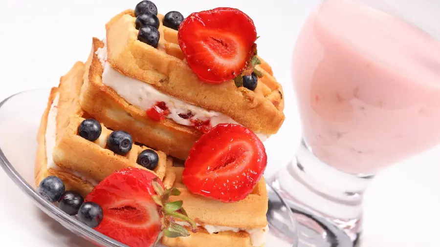 Image of Delicious Layered Dessert with Strawberry Decoration 2023