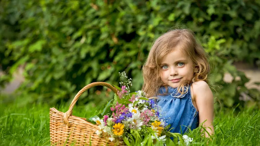 Photo of a beautiful little baby girl with bright green eyes