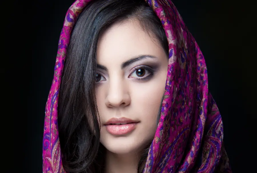 Natural face image of a black-haired girl with a beautiful scarf for a telegram profile