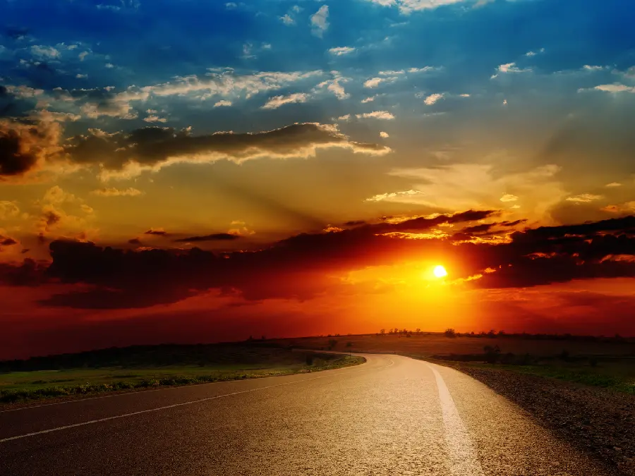 Photo of straight road and interesting sunset