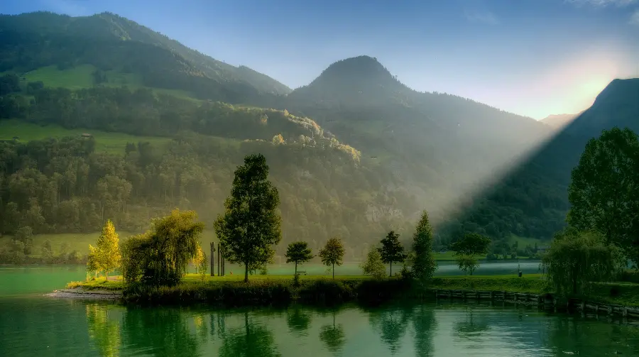 A relaxing photo of a beautiful lake in the nature of Switzerland