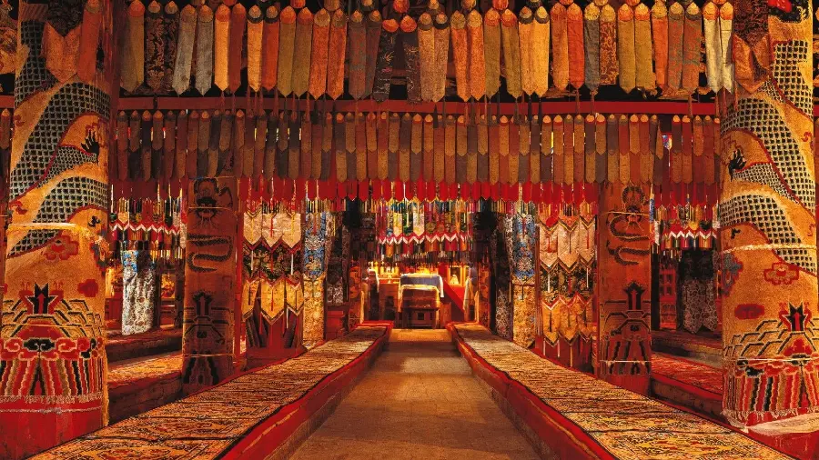 Interesting photo inside a Tibetan temple with red and orange decorations