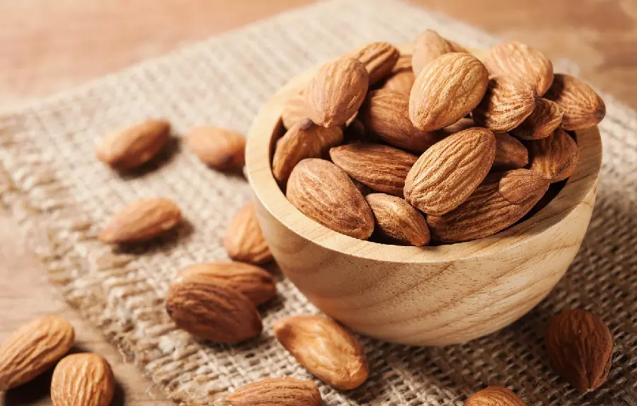 Super Delicious Salted Almonds in Wooden Bowl