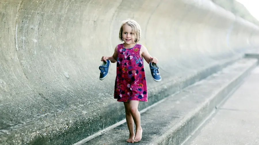 A very beautiful photo of a beautiful little girl without shoes