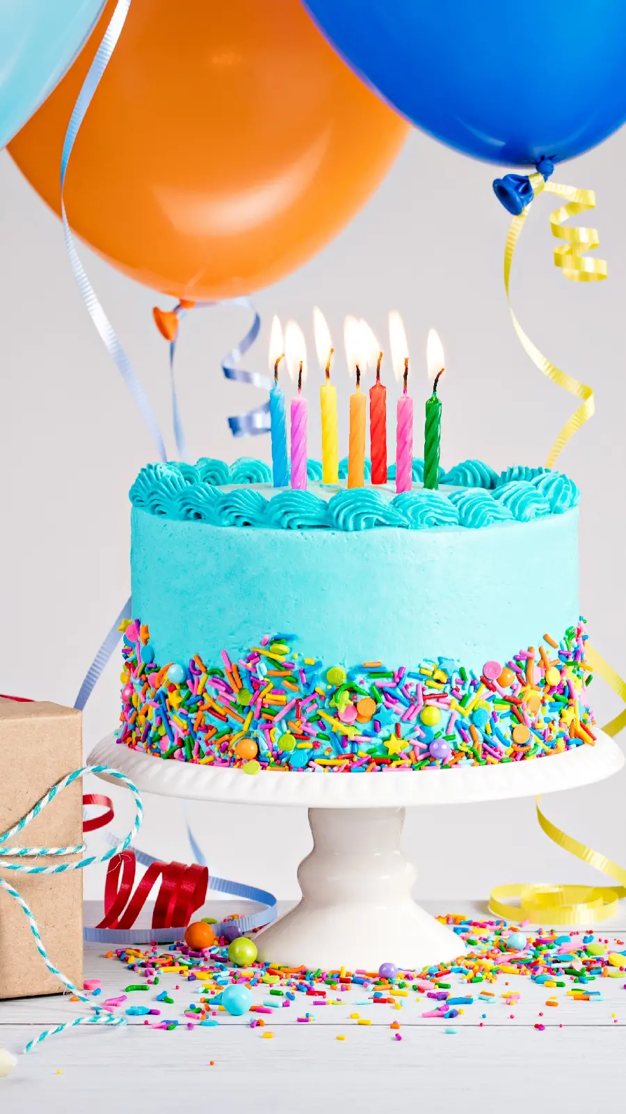 Stock photo of a pleasant blue birthday cake with colorful decoration