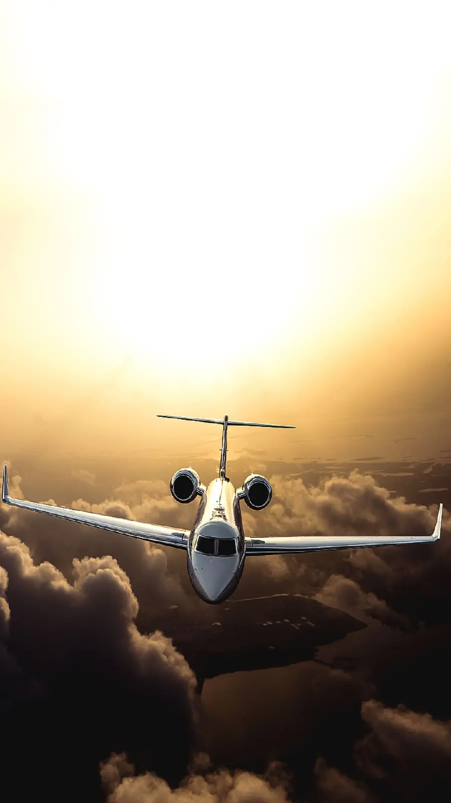 Photo of a private jet above the sunset sky