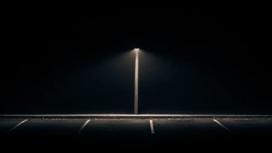 Picture of a bright light on a street at night for an Instagram post
