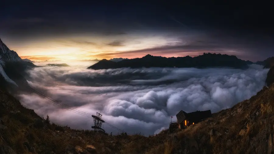 Download a dreamy image of a beautiful ocean of clouds over the mountains