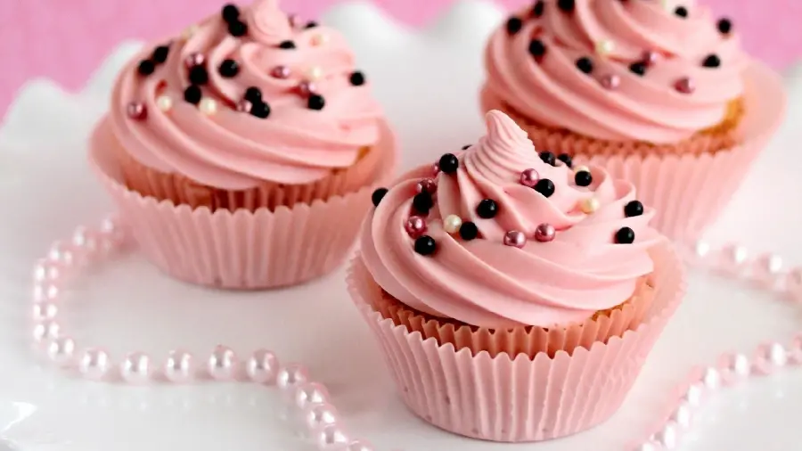 Girly pink cupcake with pearl decoration for birthday idea
