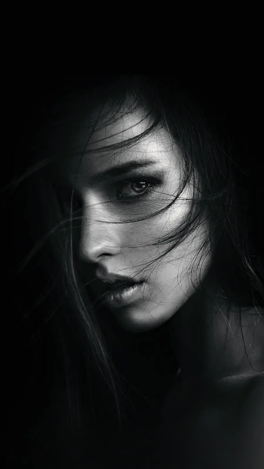 Super luxurious black and white portrait of an attractive girl's face in HD resolution