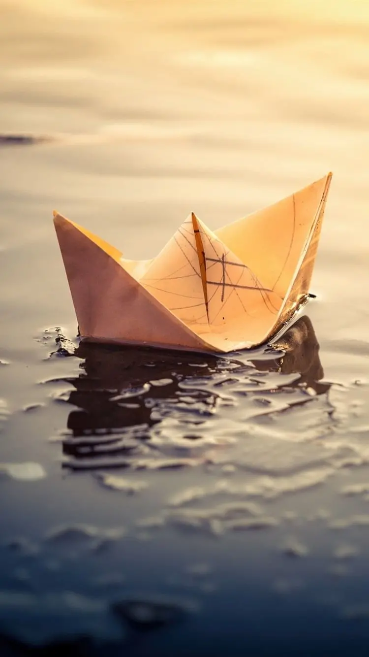 Beautiful paper boat background on the water for mobile phones in full hd quality