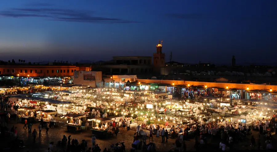 Energetic wallpaper of the bustling market of Morocco at night 2023