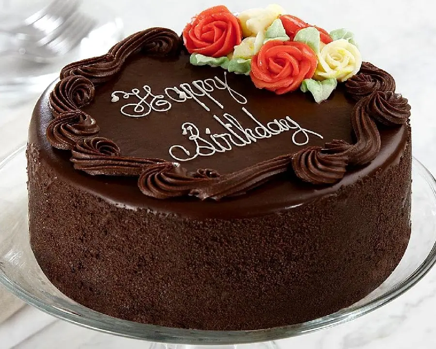 Stylish photo of a chocolate birthday cake with beautiful flower decoration in 8K quality