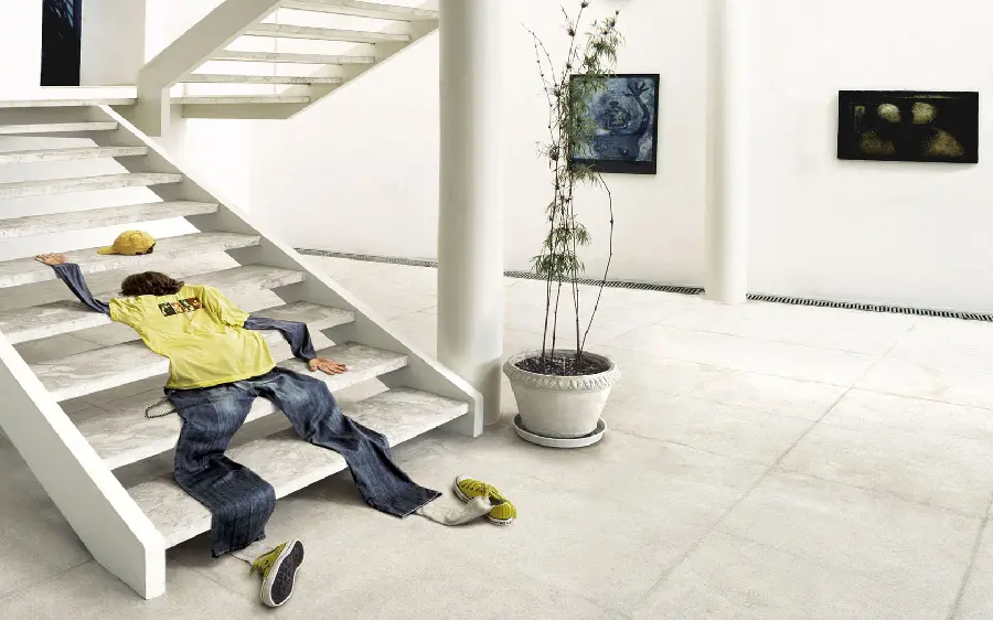 3D drawing of optical illusion of clothes falling on the stairs in the shape of a person