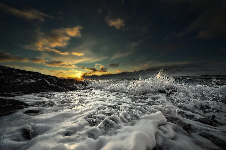 Wallpaper of roaring water waves in sunset nature for laptop and computer