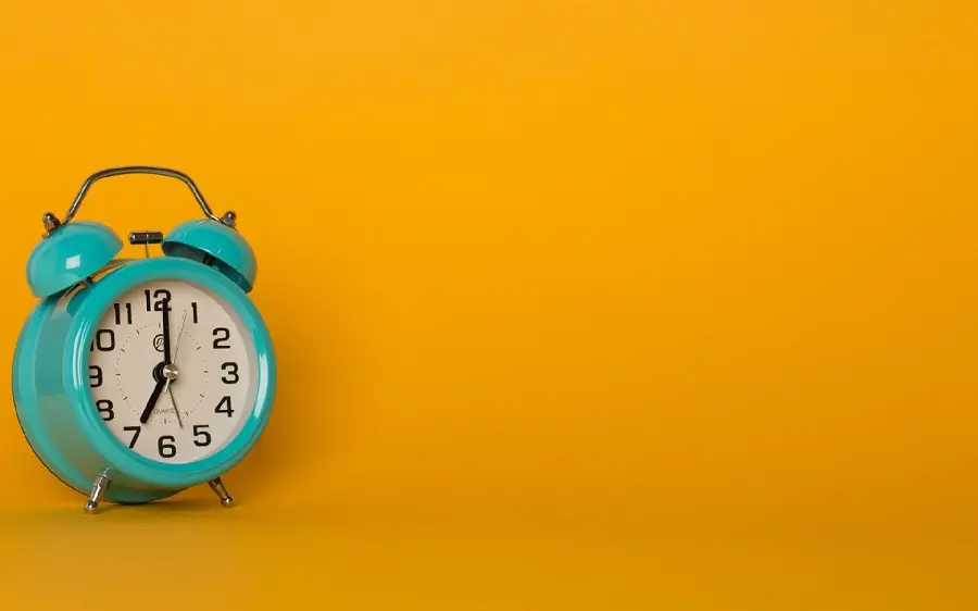 8K raw photo of an alarm clock for writing motivational text
