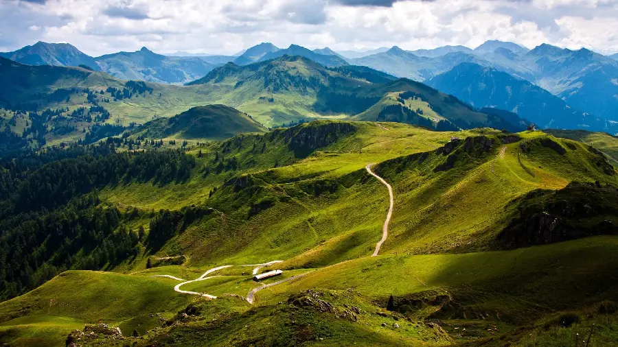 Magnificent Laptop Wallpaper with a Green Mountain Scene and Pleasant Weather