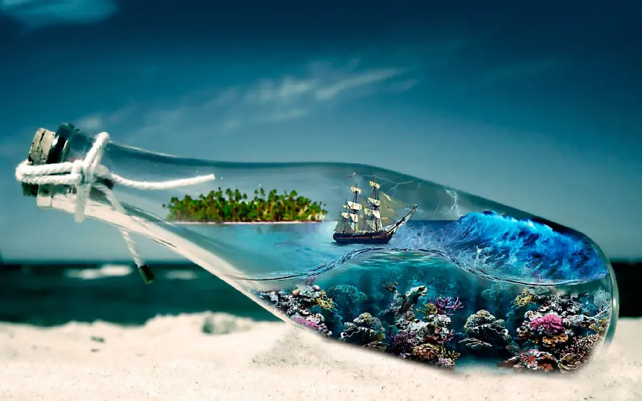 Amazing small sea background in a glass bottle on the beach