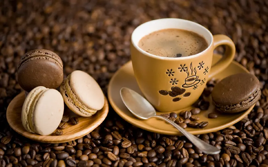 Artistic photo of coffee and delicious macaron sweets free download