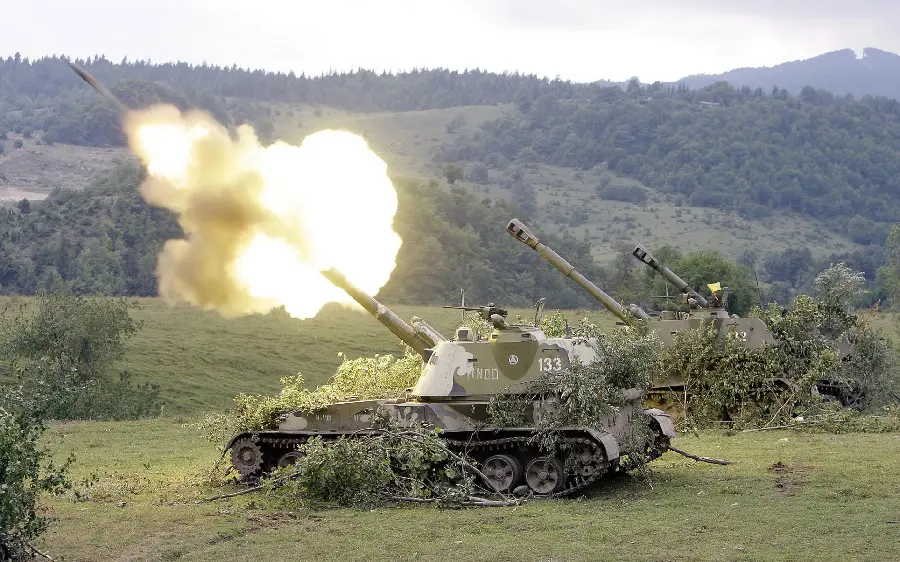 Interesting Background of a Camouflaged Tank Firing