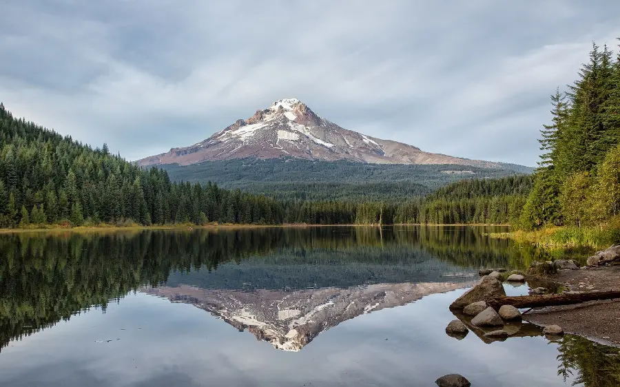 Download Magnificent Profile of Big Mountain and Reflection in Lake
