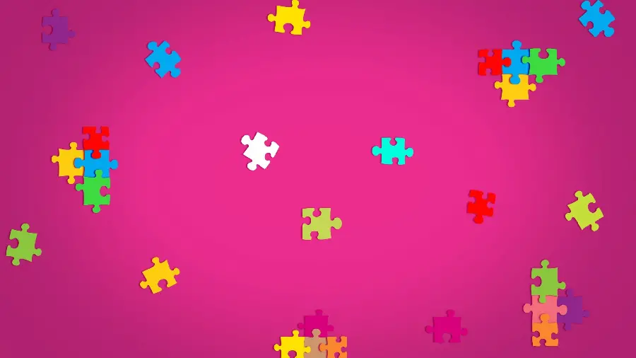 Girly Windows 12 wallpaper with a puzzle design with a pink background