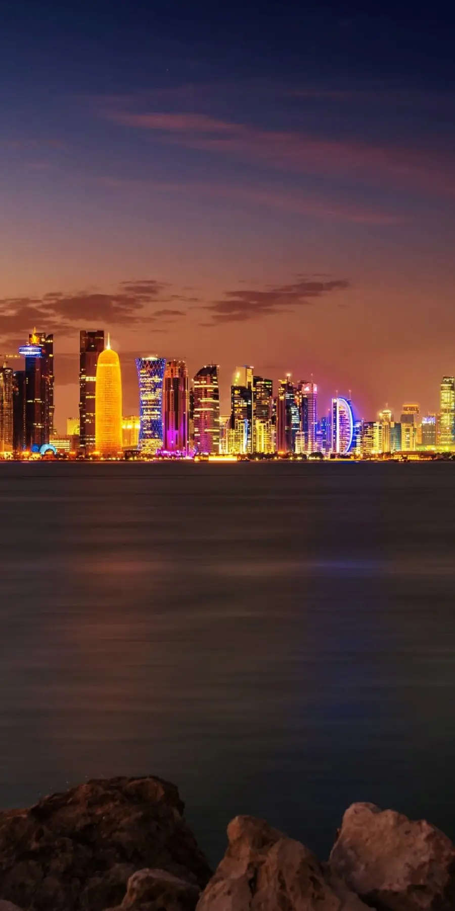 Mobile wallpaper of the city at night and tall buildings in 4K quality