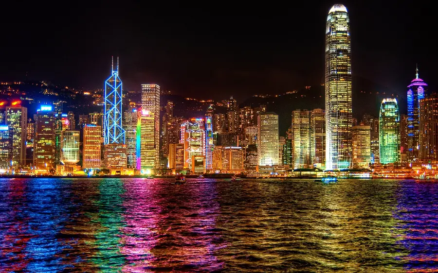 Wallpaper of dreamy and tall buildings with colored lights for computer