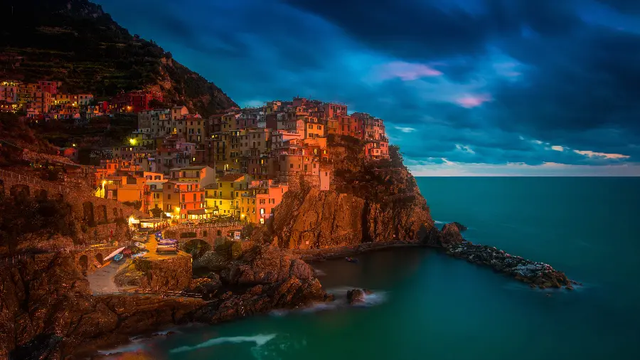 Ultra HD background of a residential area on the seashore at night