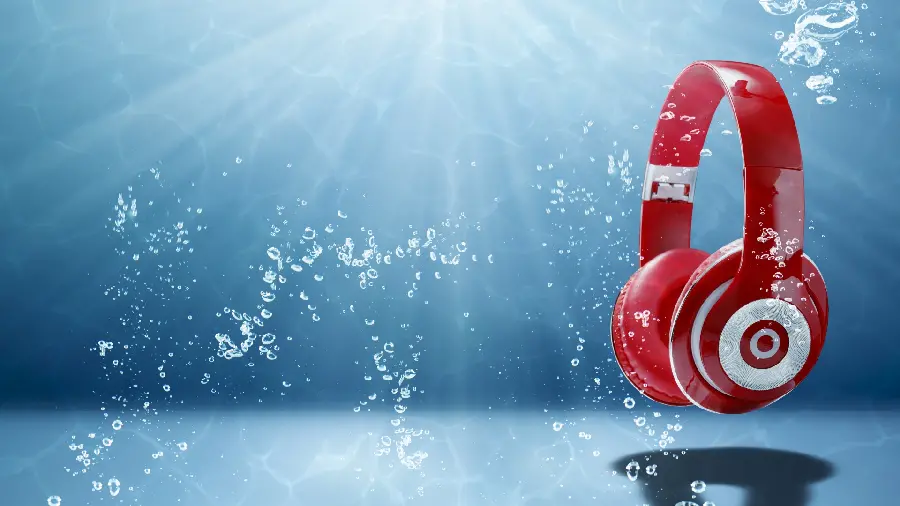 Strange computer wallpaper with a red headphone design in the water