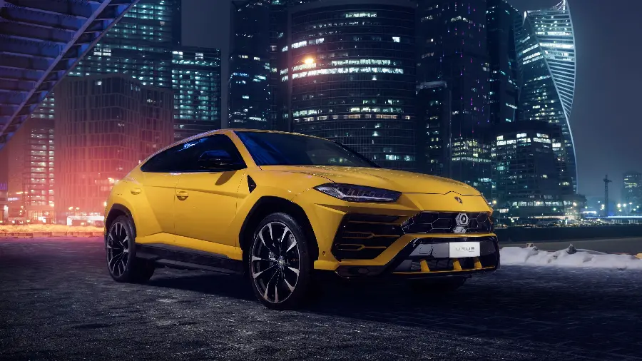 Yellow Lamborghini SUV with dark background for desktop