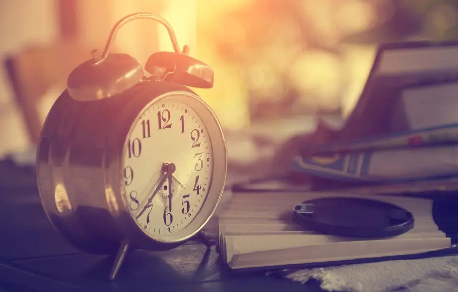 Magical photo of a clock and a book suitable for a college entrance exam profile