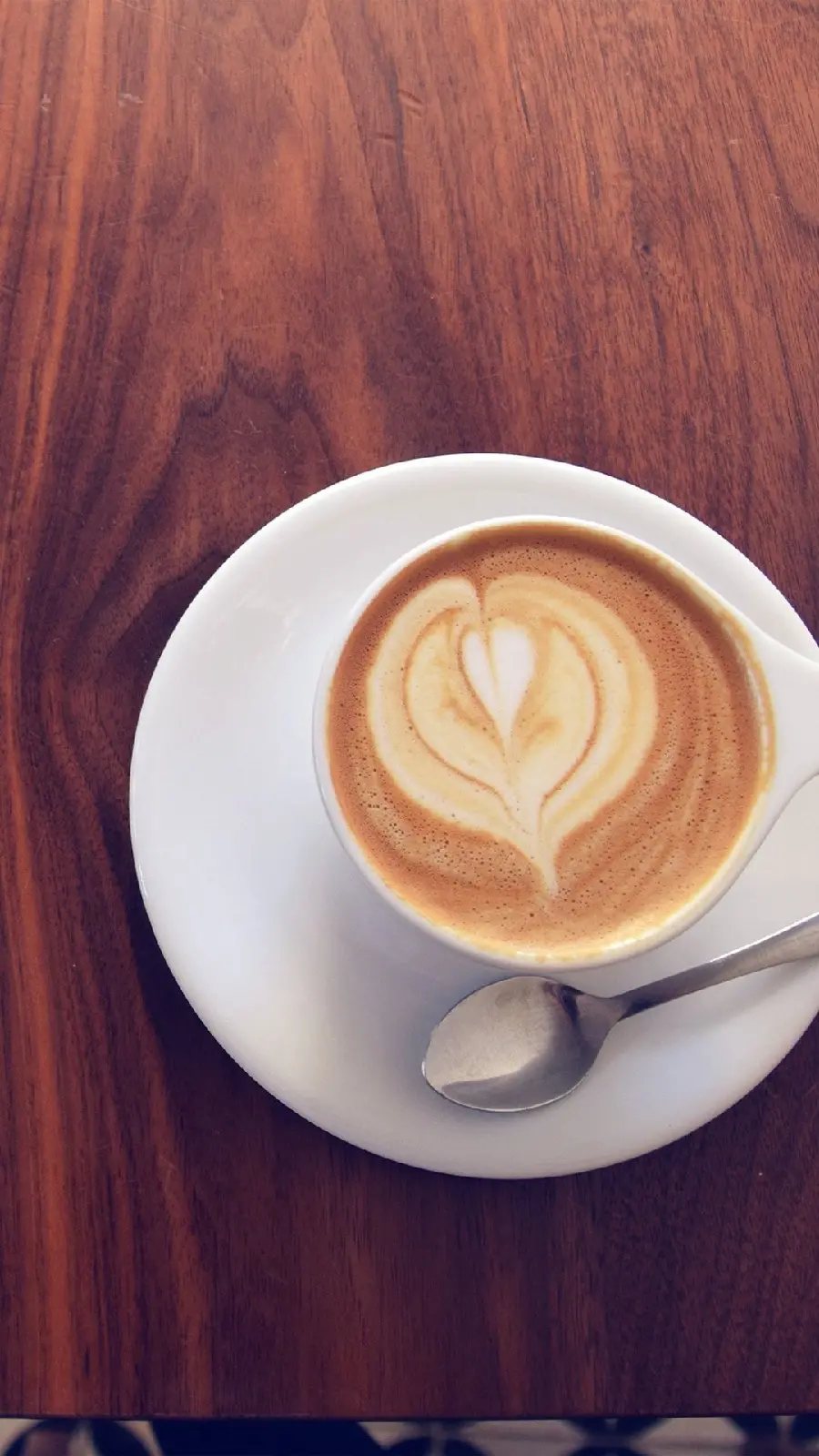 Photo of coffee cup on the table to make a new photo caption