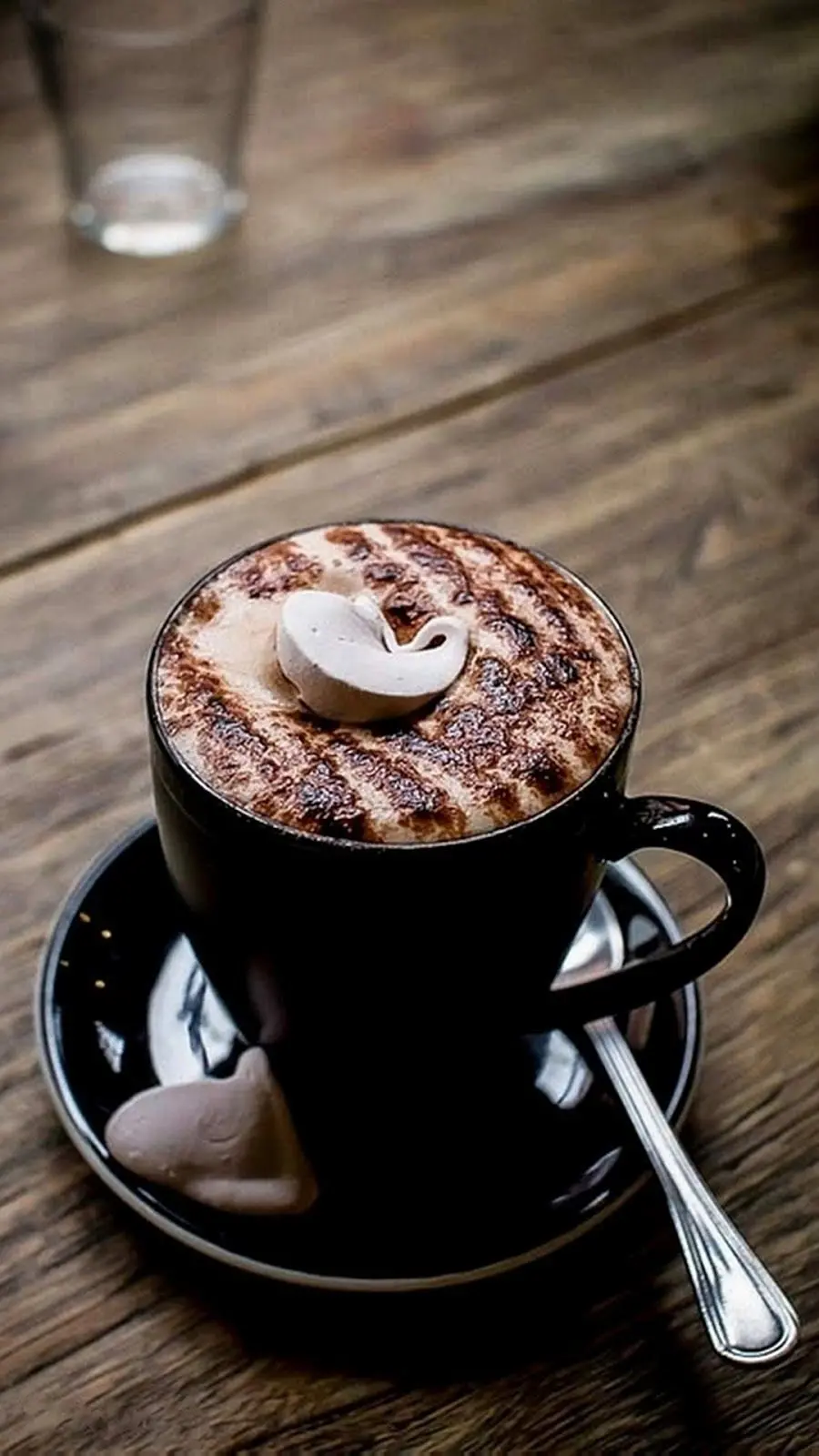 Stylish coffee cup with amazing decoration on coffee shop table