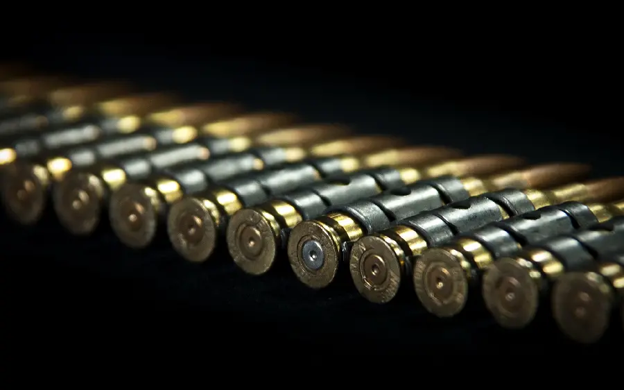Wallpaper and wallpaper of bullets and cartridges of weapons and rifles on a black background